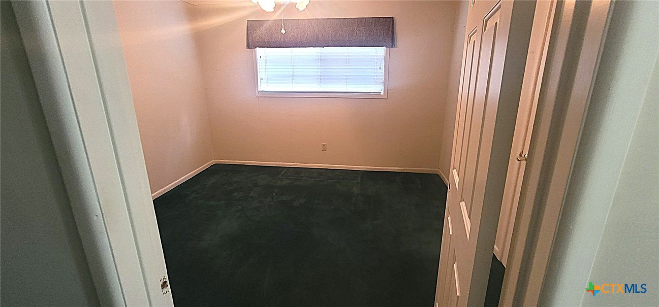 2602 College Drive Victoria, TX 77901 - Photo 26 of 29 a view of a small space with wooden floor and a window