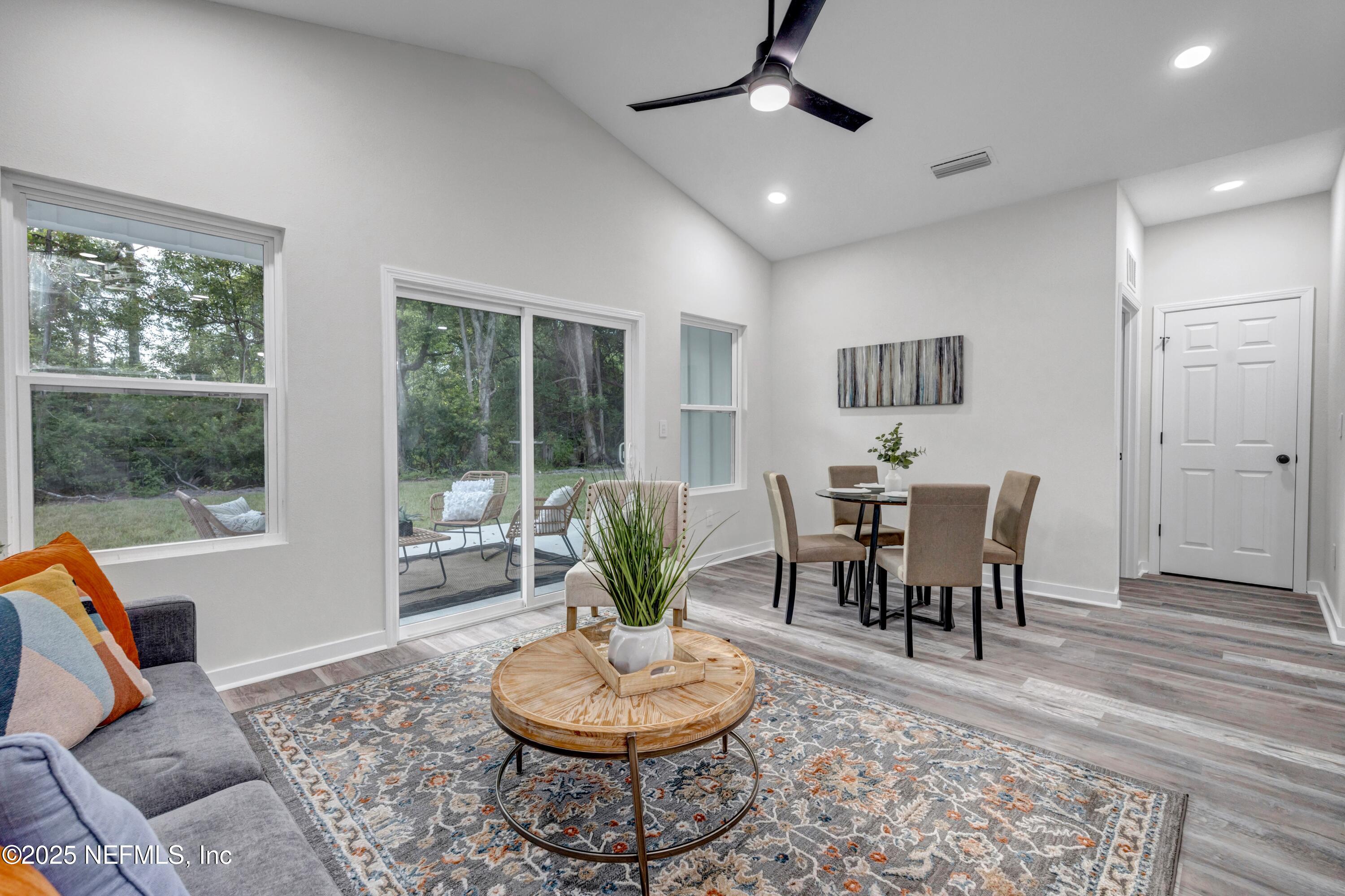 85 Delmonte Street Baldwin, FL 32234 - Photo 16 of 34 a living room with furniture and a window
