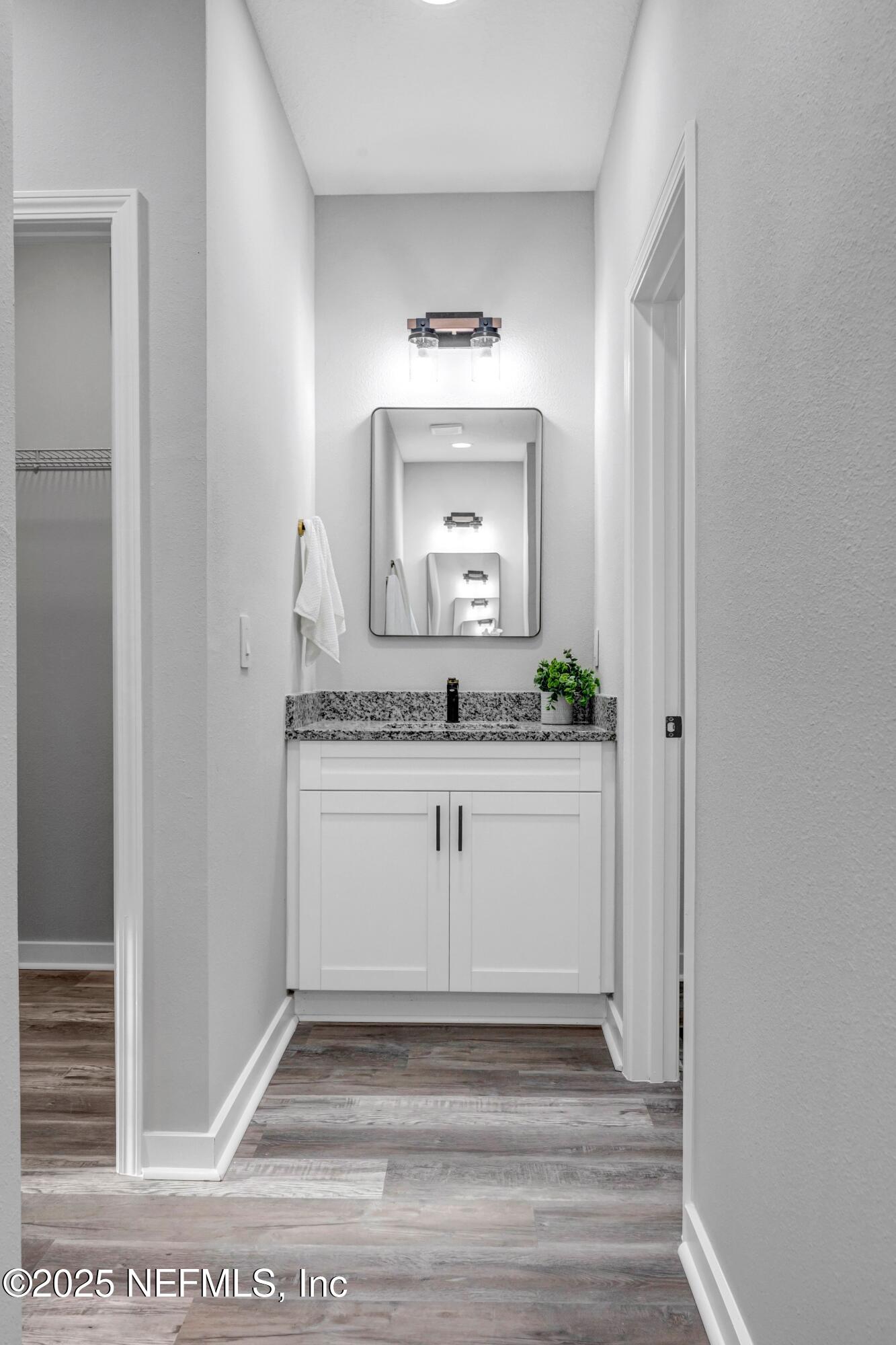 85 Delmonte Street Baldwin, FL 32234 - Photo 25 of 34 a bathroom with a sink and a mirror