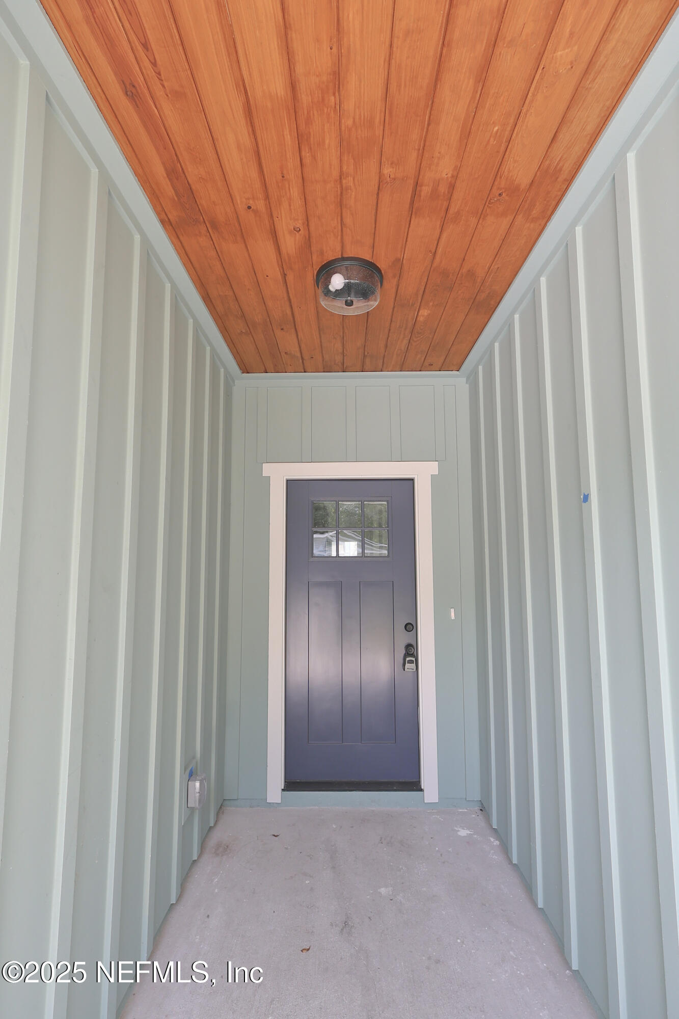 85 Delmonte Street Baldwin, FL 32234 - Photo 3 of 34 a view of a hallway with entryway door