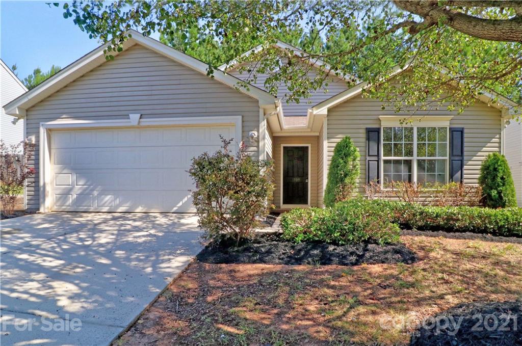 1509 Summit Ridge Lane Kannapolis, NC 28083 - Photo 2 of 37 a front view of a house with a yard and potted plants