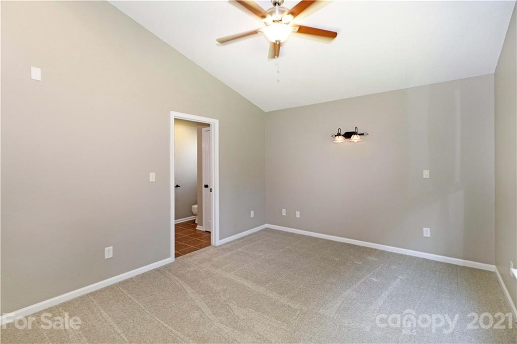 1509 Summit Ridge Lane Kannapolis, NC 28083 - Photo 17 of 37 a view of an empty room with a chandelier fan
