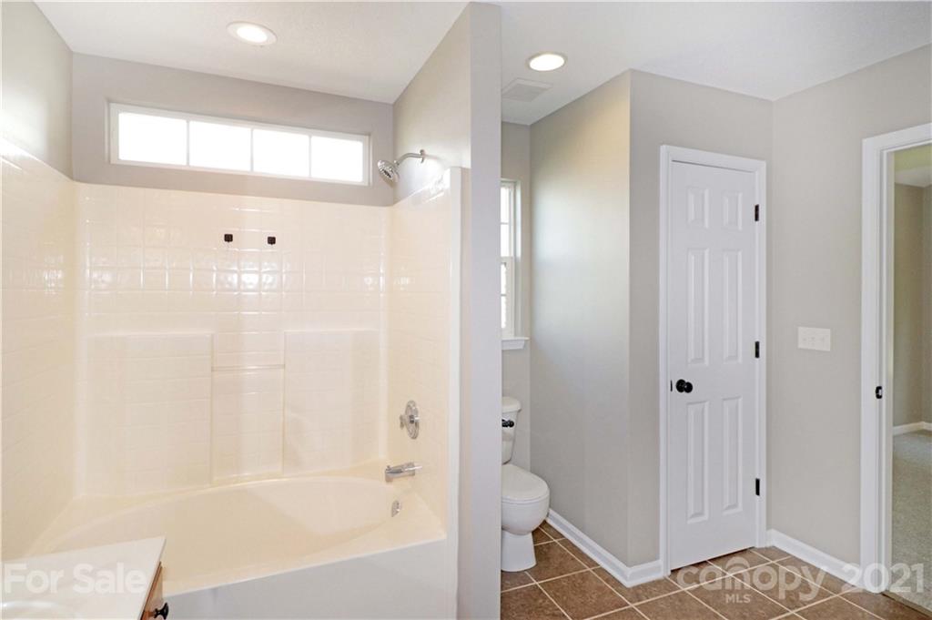 1509 Summit Ridge Lane Kannapolis, NC 28083 - Photo 22 of 37 a bathroom with a bathtub and a shower