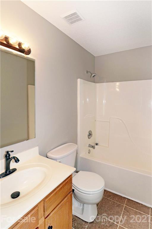 1509 Summit Ridge Lane Kannapolis, NC 28083 - Photo 26 of 37 a bathroom with a sink a toilet and shower