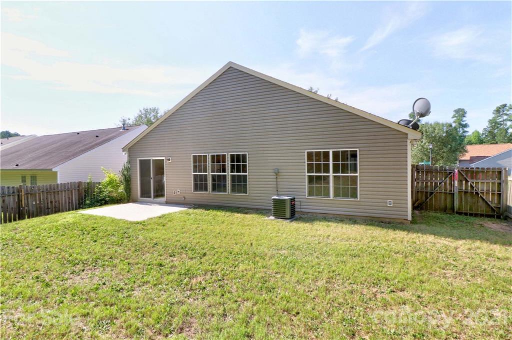 1509 Summit Ridge Lane Kannapolis, NC 28083 - Photo 33 of 37 a view of a house with a yard and garage