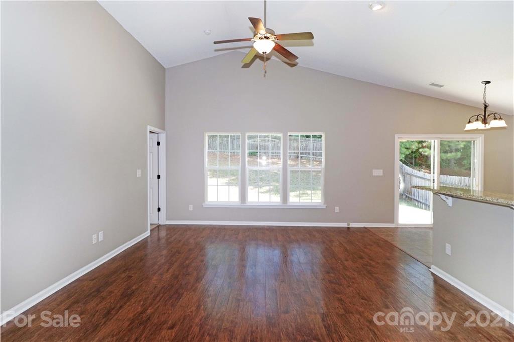 1509 Summit Ridge Lane Kannapolis, NC 28083 - Photo 5 of 37 a view of an empty room with a window and wooden floor