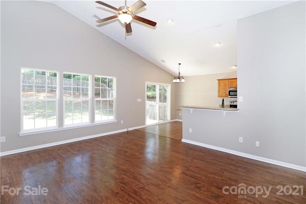 1509 Summit Ridge Lane Kannapolis, NC 28083 - Photo 6 of 37 a view of an empty room with wooden floor and a window