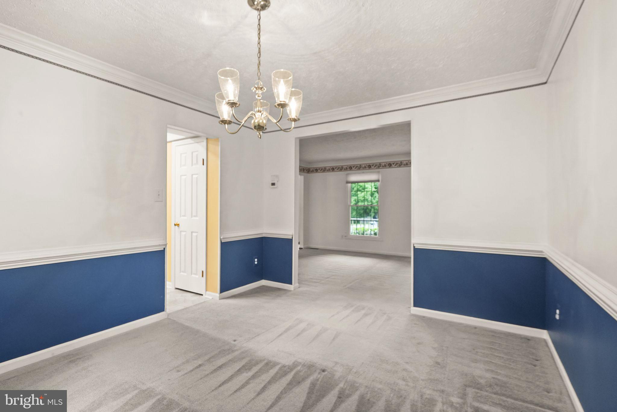 169 Applegate Drive Sterling, VA 20164 - Photo 14 of 55 a view of a chandelier and a chandelier fan in a room