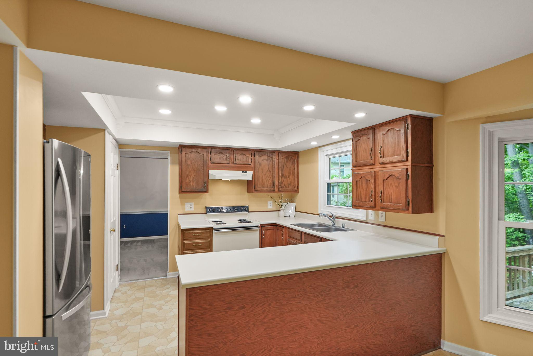 169 Applegate Drive Sterling, VA 20164 - Photo 15 of 55 a kitchen with a sink stove and refrigerator
