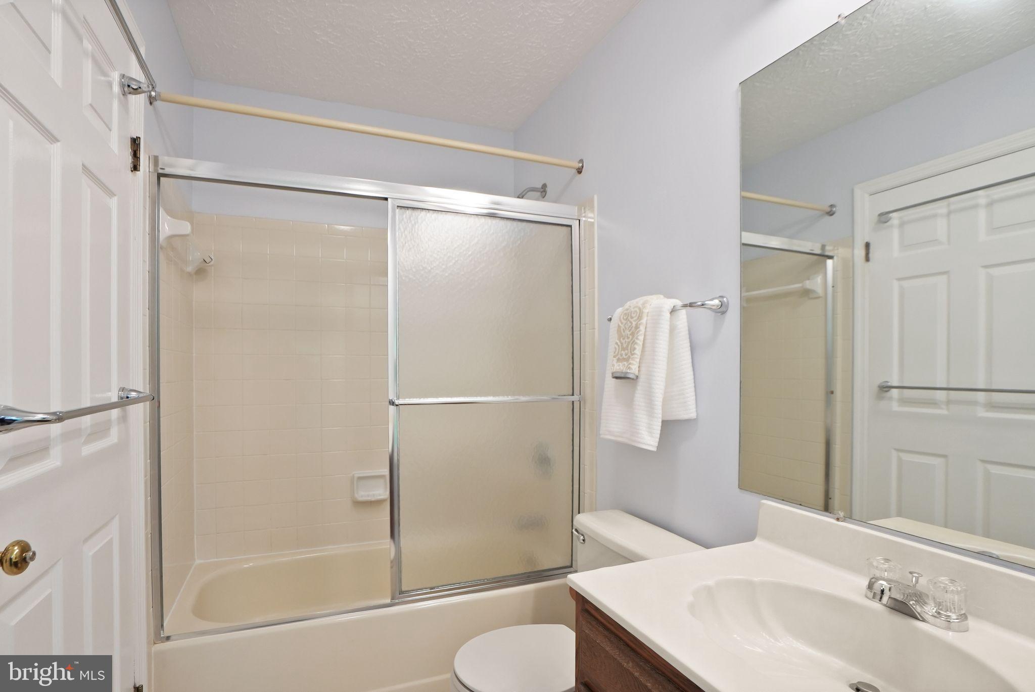 169 Applegate Drive Sterling, VA 20164 - Photo 29 of 55 a bathroom with a shower and a sink