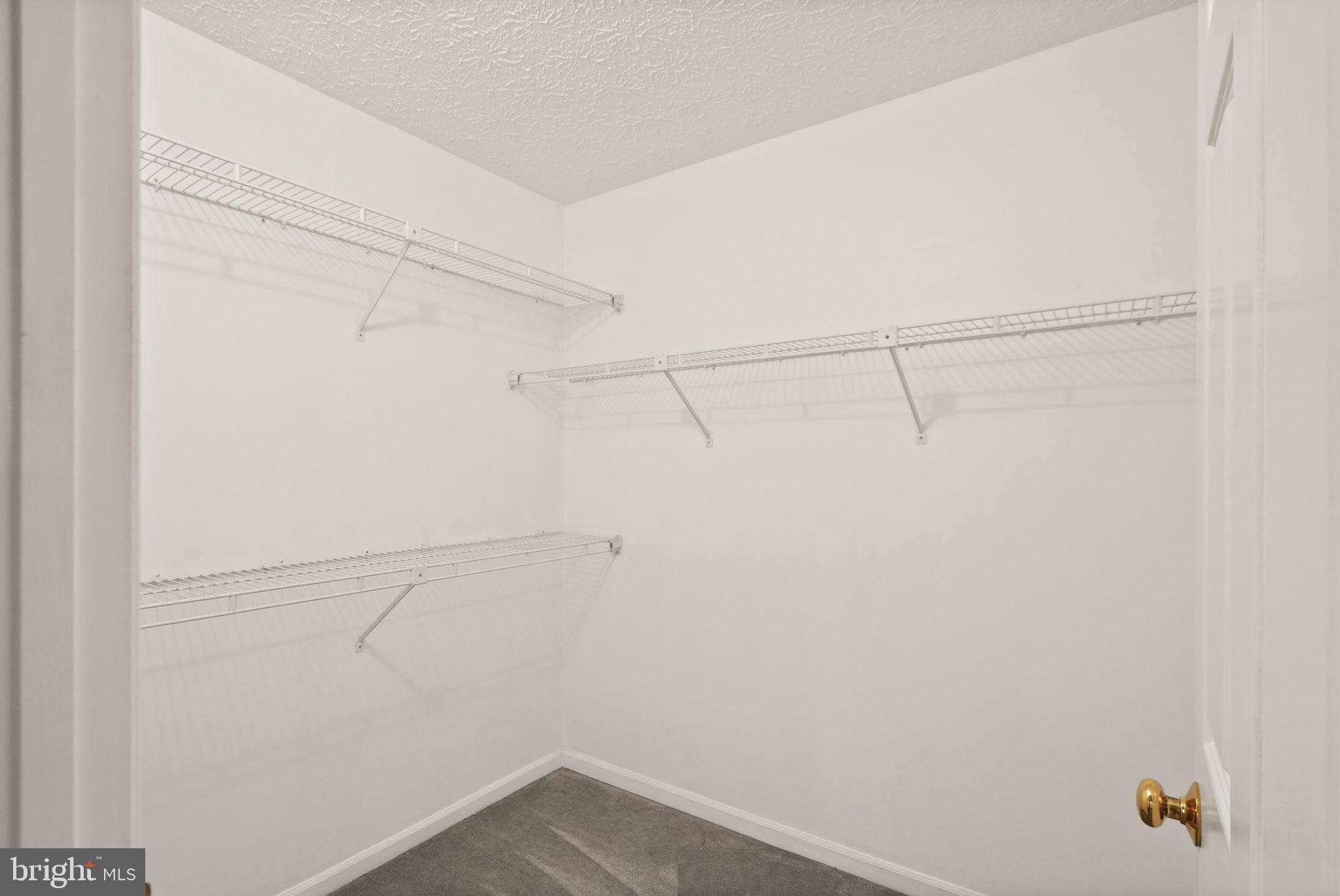169 Applegate Drive Sterling, VA 20164 - Photo 30 of 55 a view of a room with racks on the wall