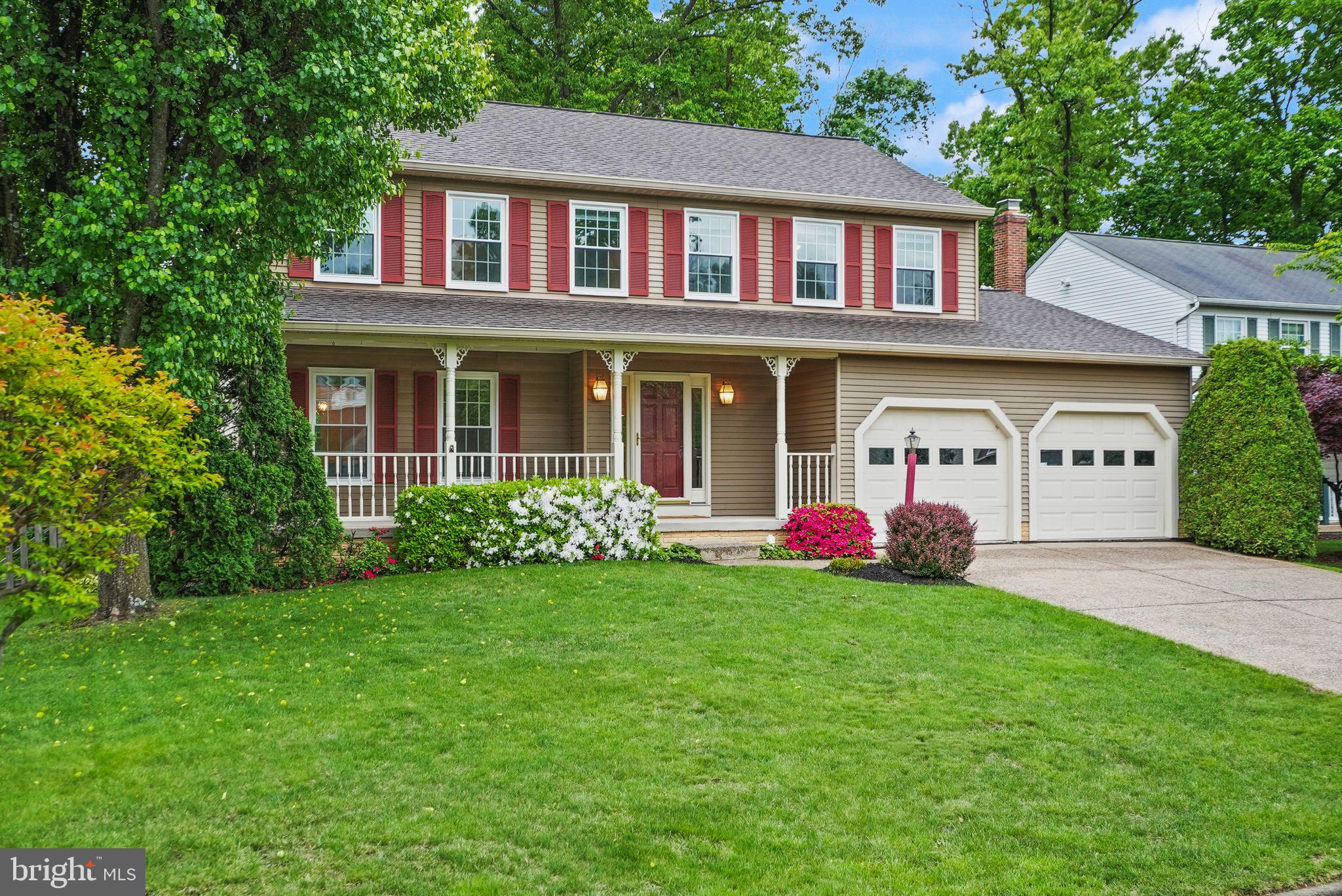 169 Applegate Drive Sterling, VA 20164 - Photo 3 of 55 a front view of a house with garden