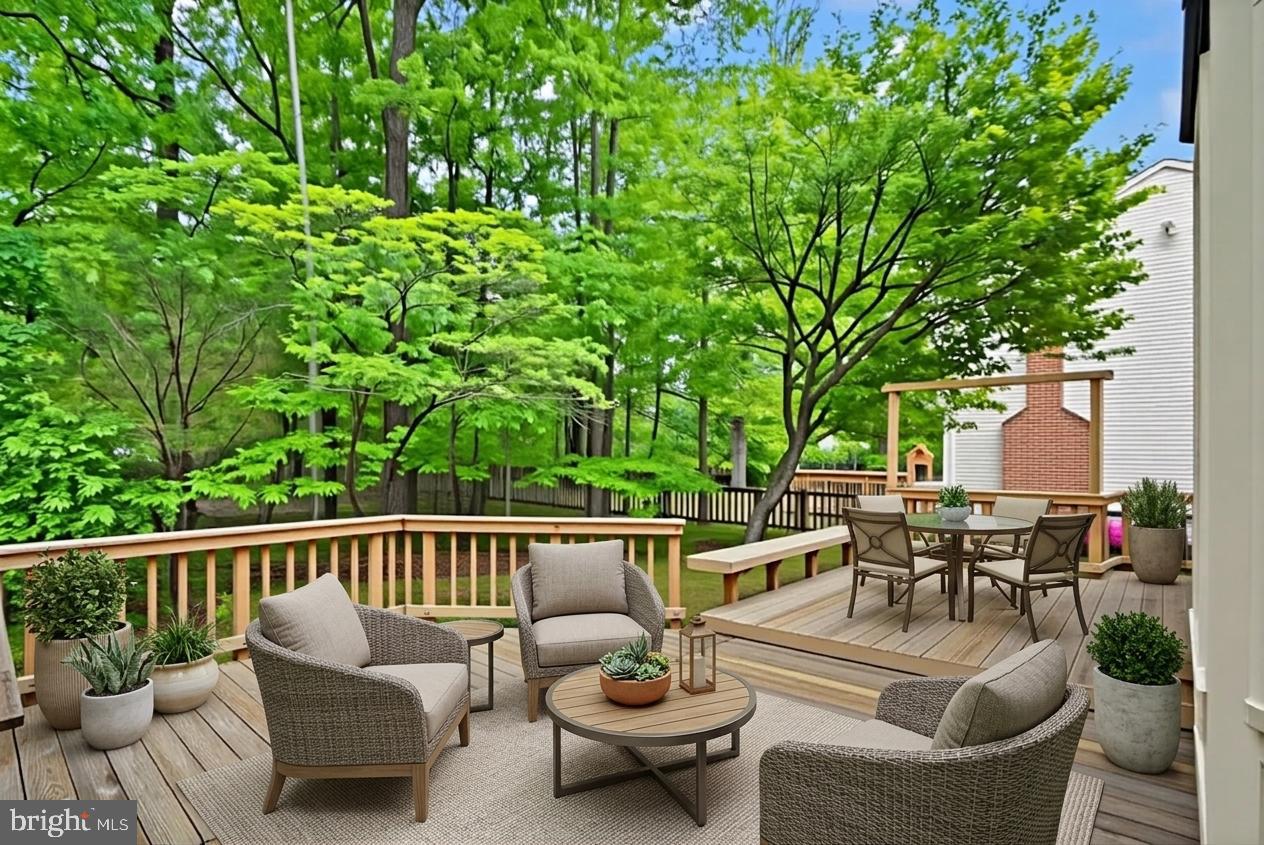 169 Applegate Drive Sterling, VA 20164 - Photo 46 of 55 a view of a patio with couches chairs and a potted plant