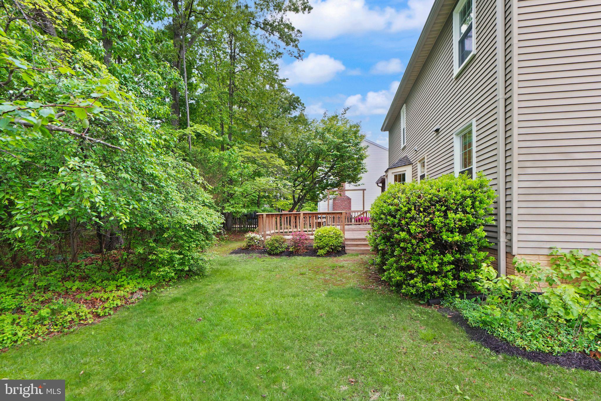 169 Applegate Drive Sterling, VA 20164 - Photo 53 of 55 a view of a garden with a house in the background