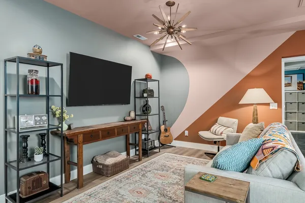 a living room with furniture and a flat screen tv