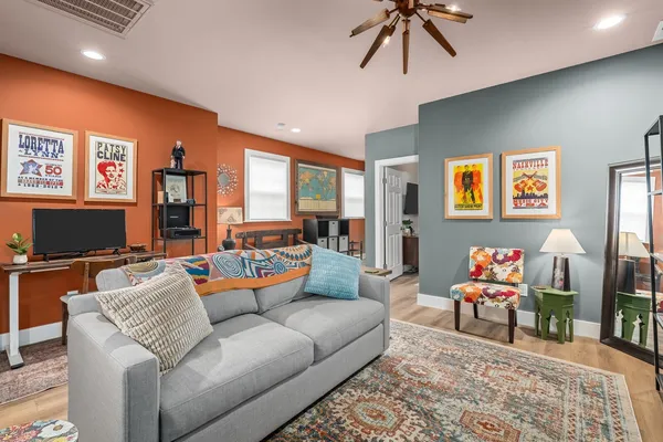 a living room with furniture and a flat screen tv