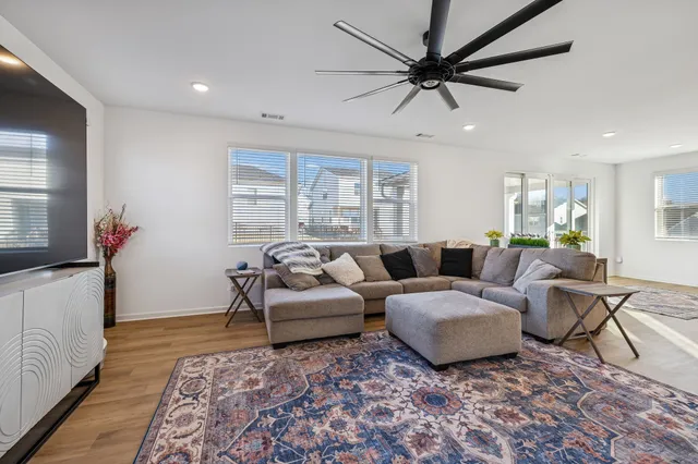 a bathroom with a sink a toilet a mirror and shower curtain