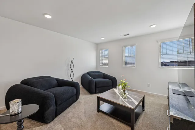a view of walk in closet with clothes