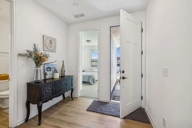 a bathroom with a sink toilet vanity and shower