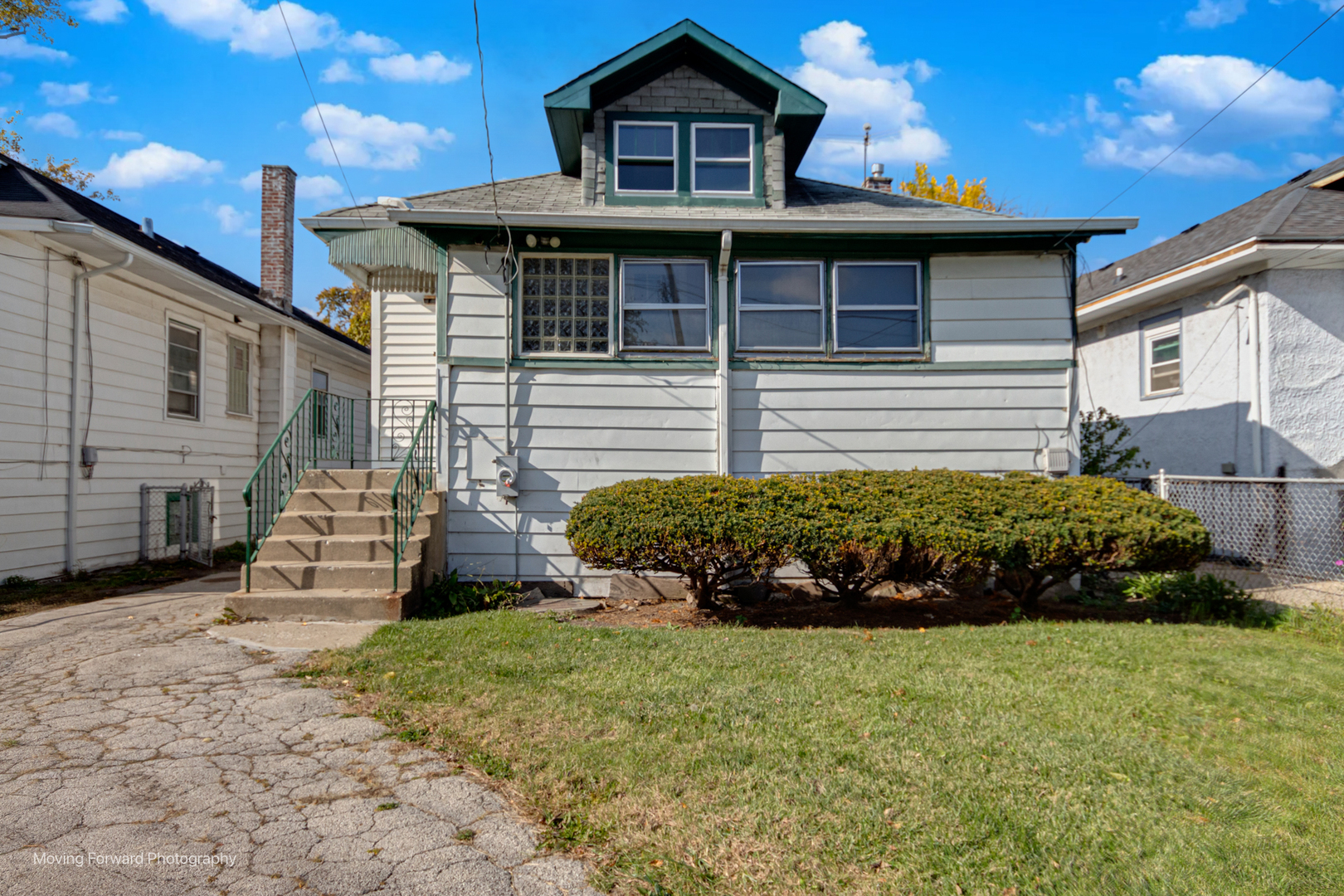 643 South 19th Avenue Maywood, IL 60153 - Photo 12 of 41 a front view of a house with a yard