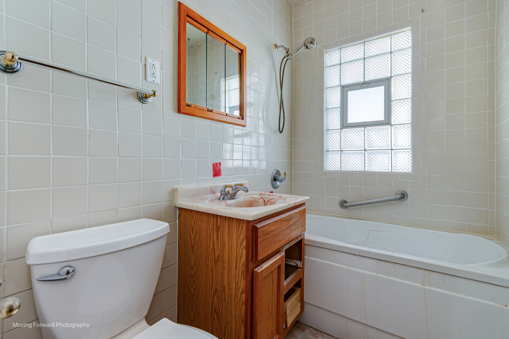 643 South 19th Avenue Maywood, IL 60153 - Photo 19 of 41 a bathroom with a sink toilet vanity and bathtub