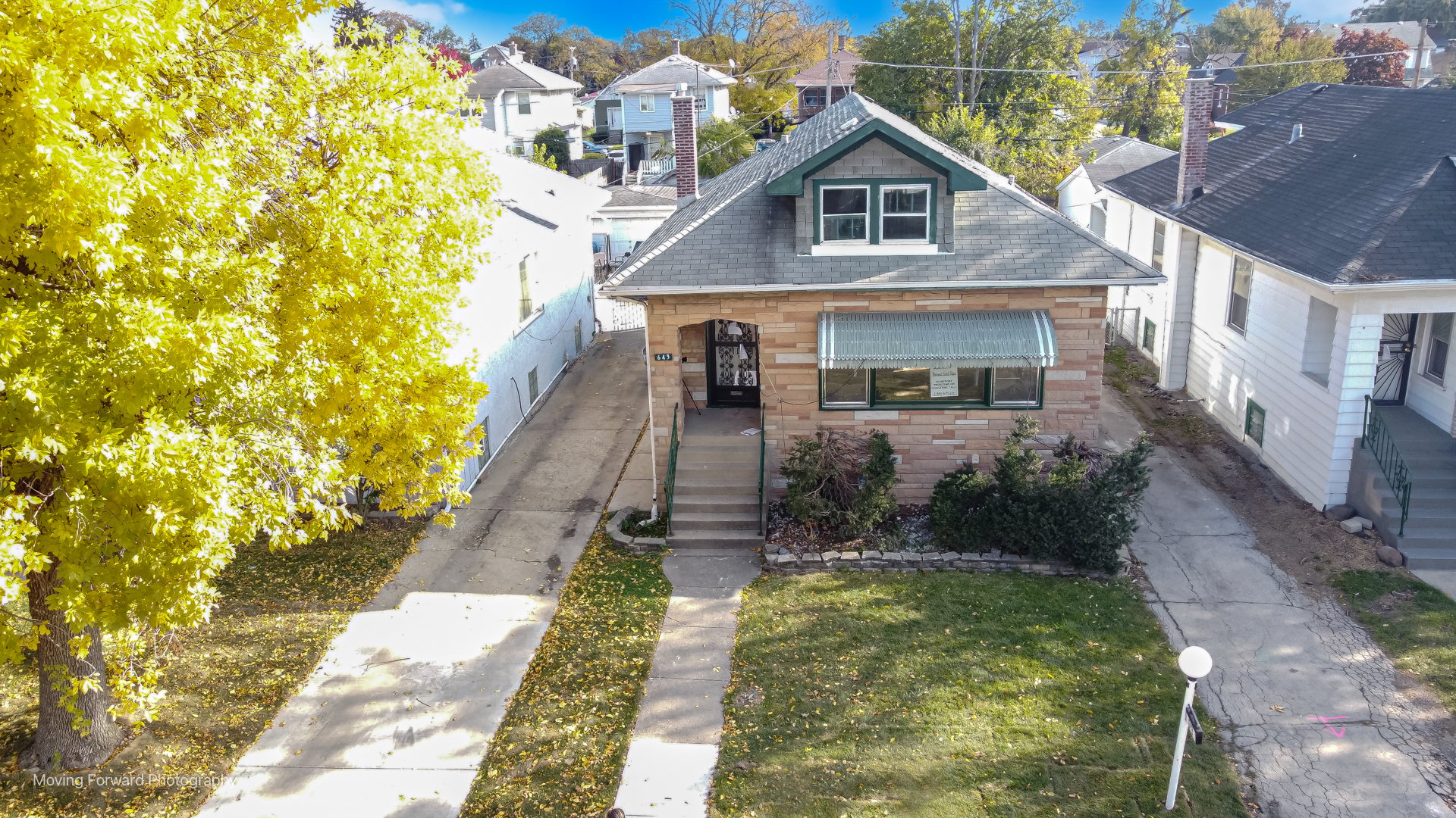 643 South 19th Avenue Maywood, IL 60153 - Photo 4 of 41 a front view of a house with garden