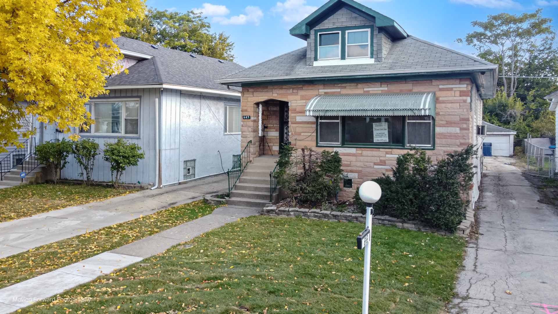 643 South 19th Avenue Maywood, IL 60153 - Photo 6 of 41 front view of a house with a yard