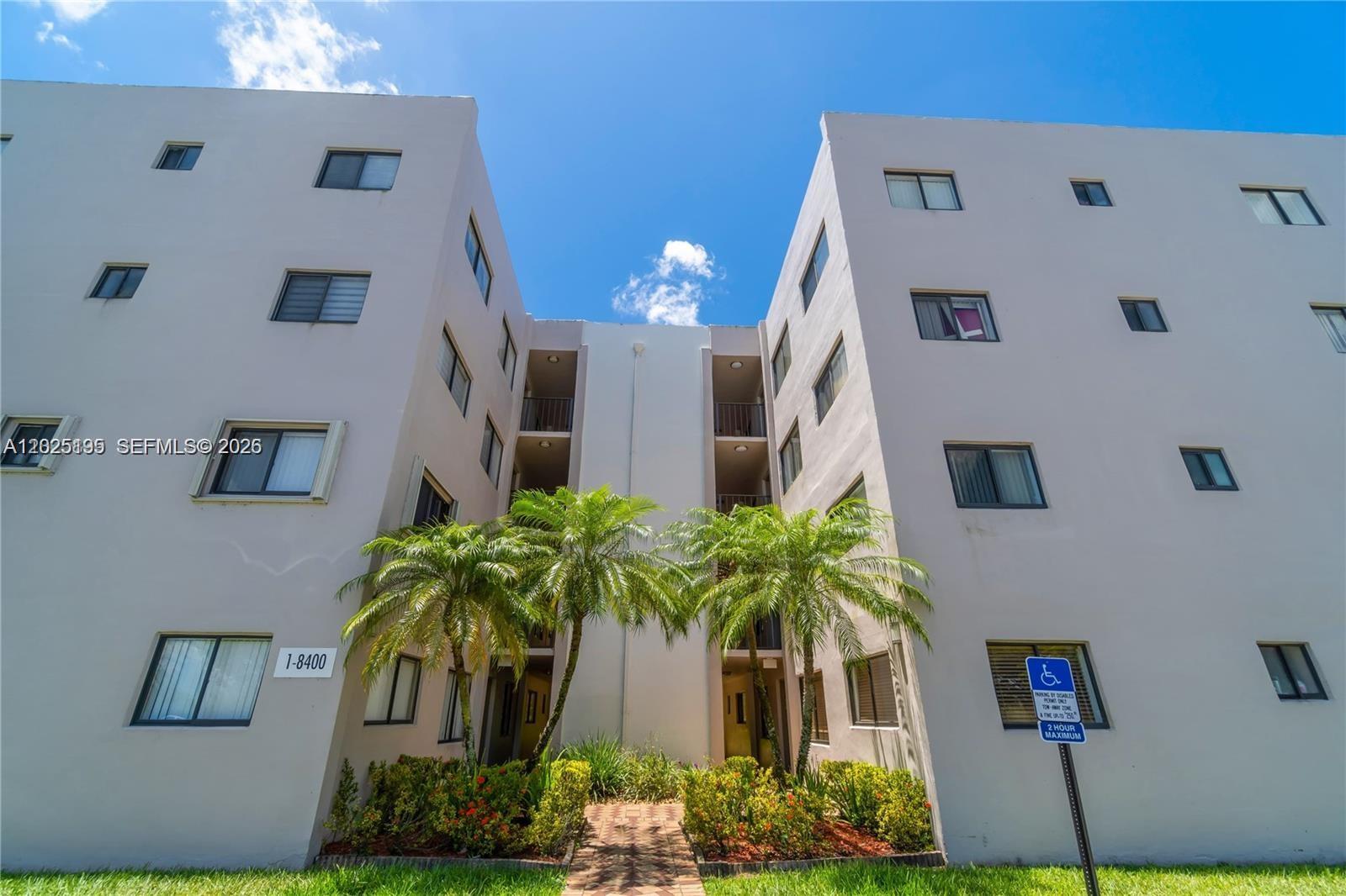 8400 Southwest 133rd Avenue Road, Unit 121 Miami, FL 33183 - Photo 13 of 43 a front view of a house with a yard