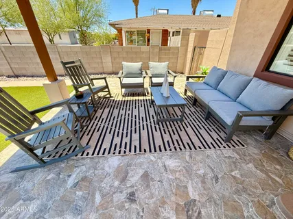 a view of a patio with a yard
