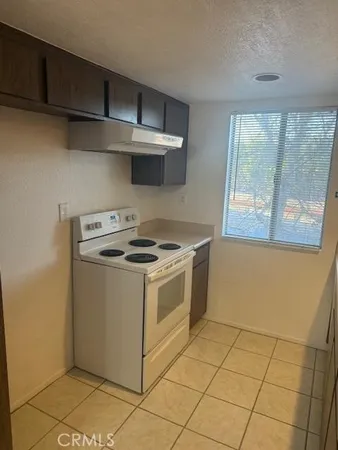 a view white cabinets and sink