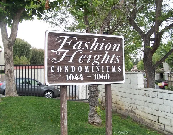 a street sign on the side of the building