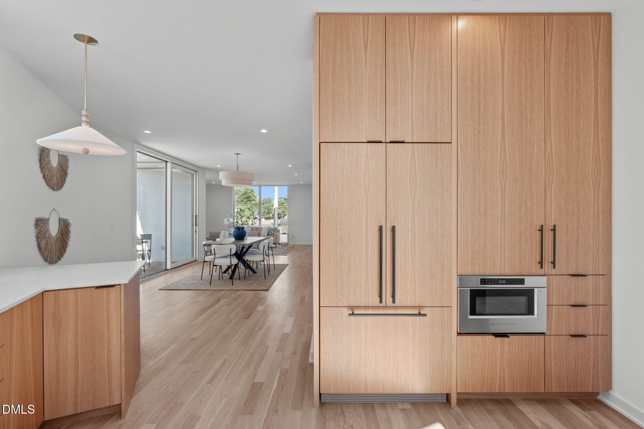1304 Chamblee Hill Raleigh, NC 27608 - Photo 16 of 46 a kitchen with a sink a refrigerator and chairs