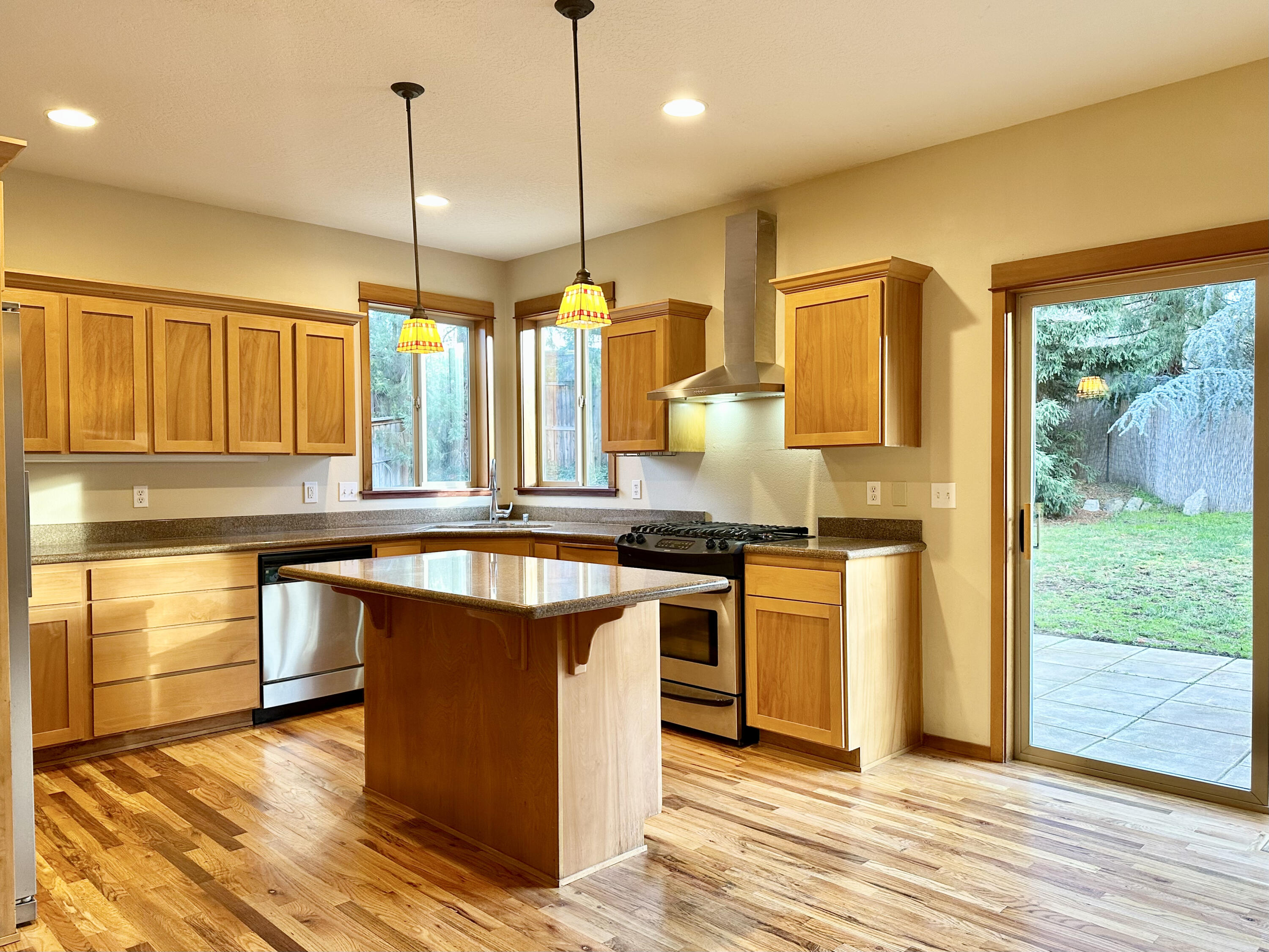 133 Max Loop Talent, OR 97540 - Photo 5 of 55 a kitchen with stainless steel appliances granite countertop a sink a stove and a wooden floors