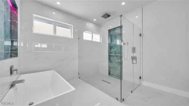 a bathroom with a bathtub and a sink