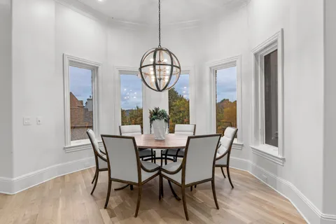 a bedroom with furniture and a large window