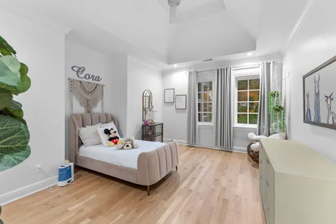 a view of a chair and fire pit in the backyard of a house