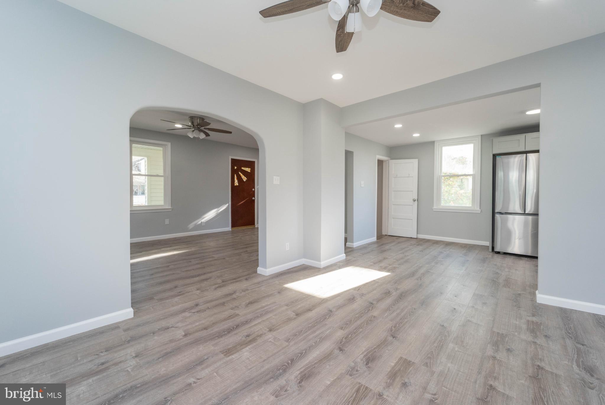 5312 Catalpha Road Baltimore, MD 21214 - Photo 21 of 59 a view of an empty room and glass door