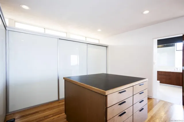 a utility room with cabinets washer and dryer