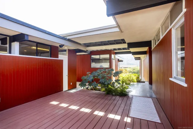 a view of a porch with wooden floor