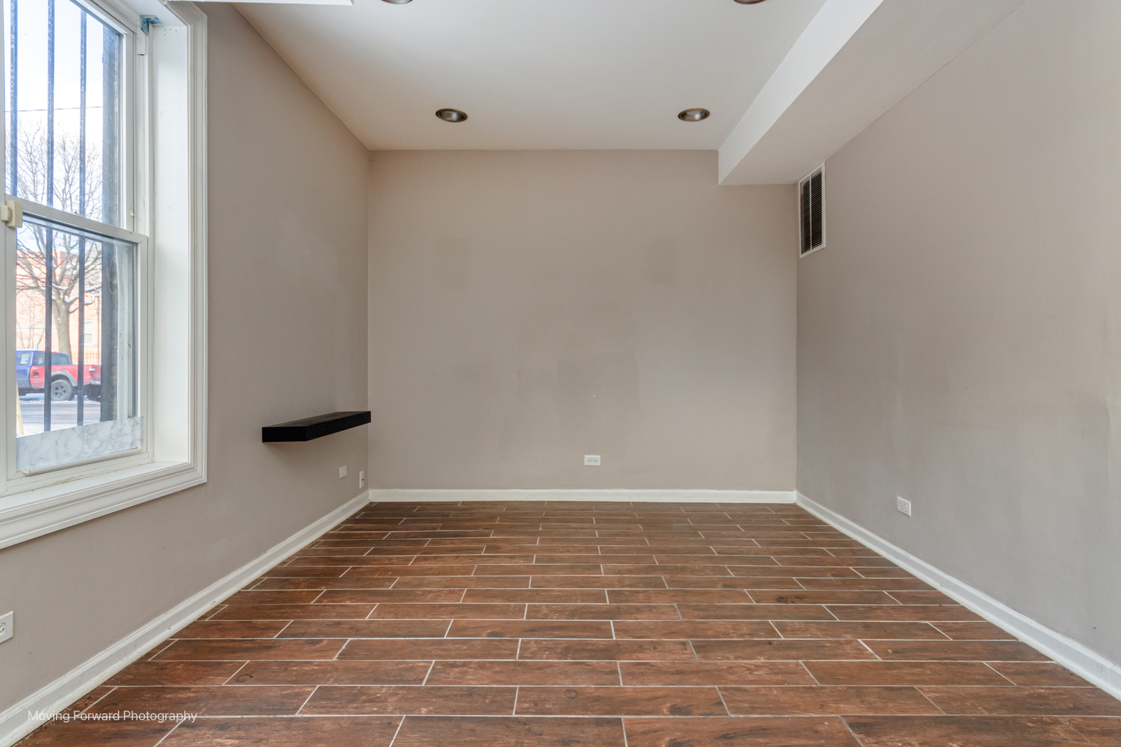 1715 East 70th Street Chicago, IL 60649 - Photo 12 of 29 a view of an empty room with a window