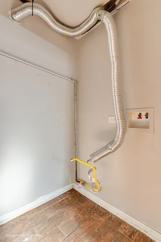 a bathroom with a shower and a glass door