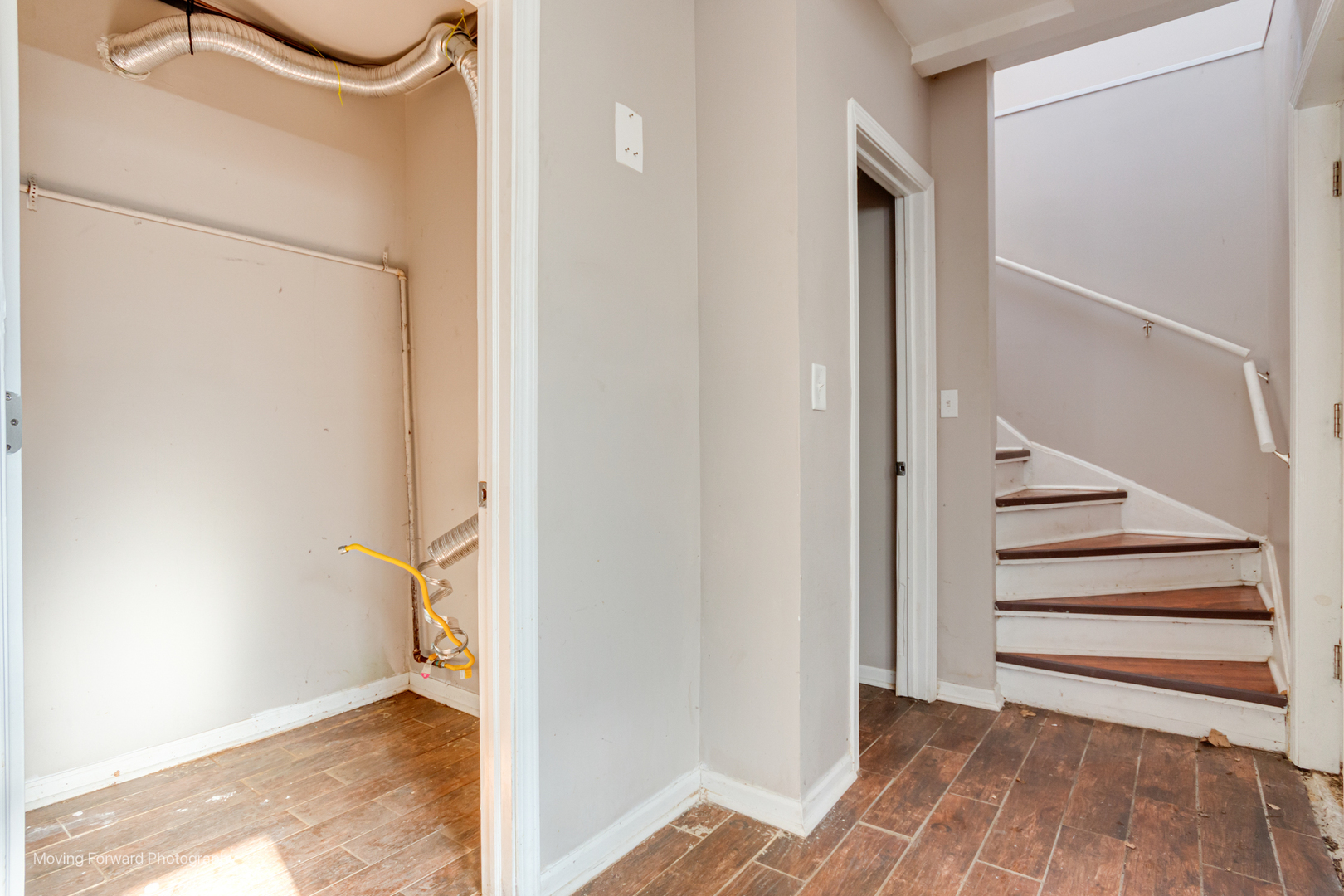 1715 East 70th Street Chicago, IL 60649 - Photo 19 of 29 a view of a bedroom with wooden floor and white walls