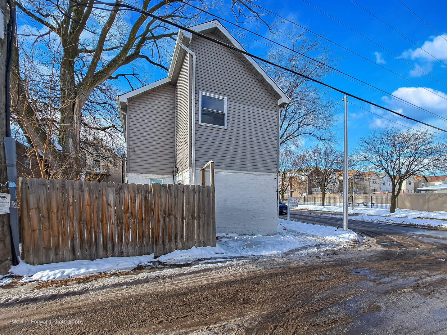 1715 East 70th Street Chicago, IL 60649 - Photo 9 of 29 a front view of a house with a road