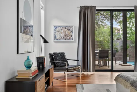 a white bath tub sitting next to a window