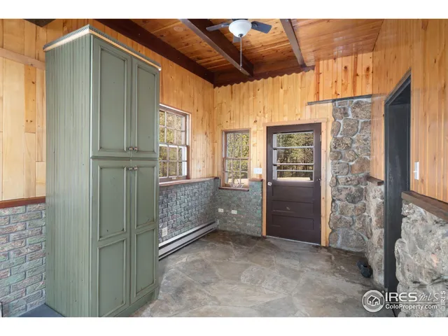 a bathroom with a tub a sink and a large mirror