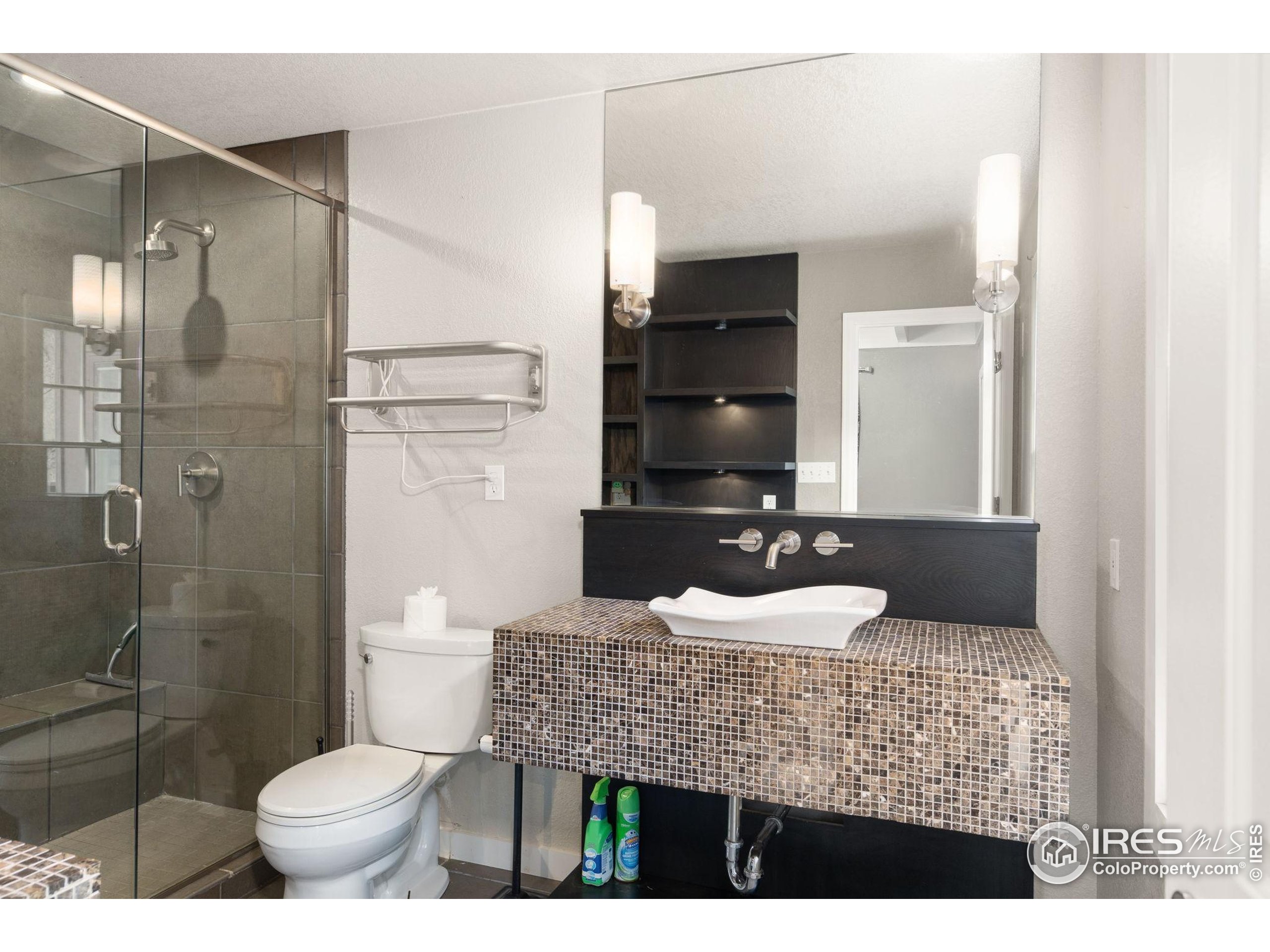 7301 Poudre Canyon Road Bellvue, CO 80512 - Photo 18 of 41 a bathroom with a granite countertop sink toilet and shower
