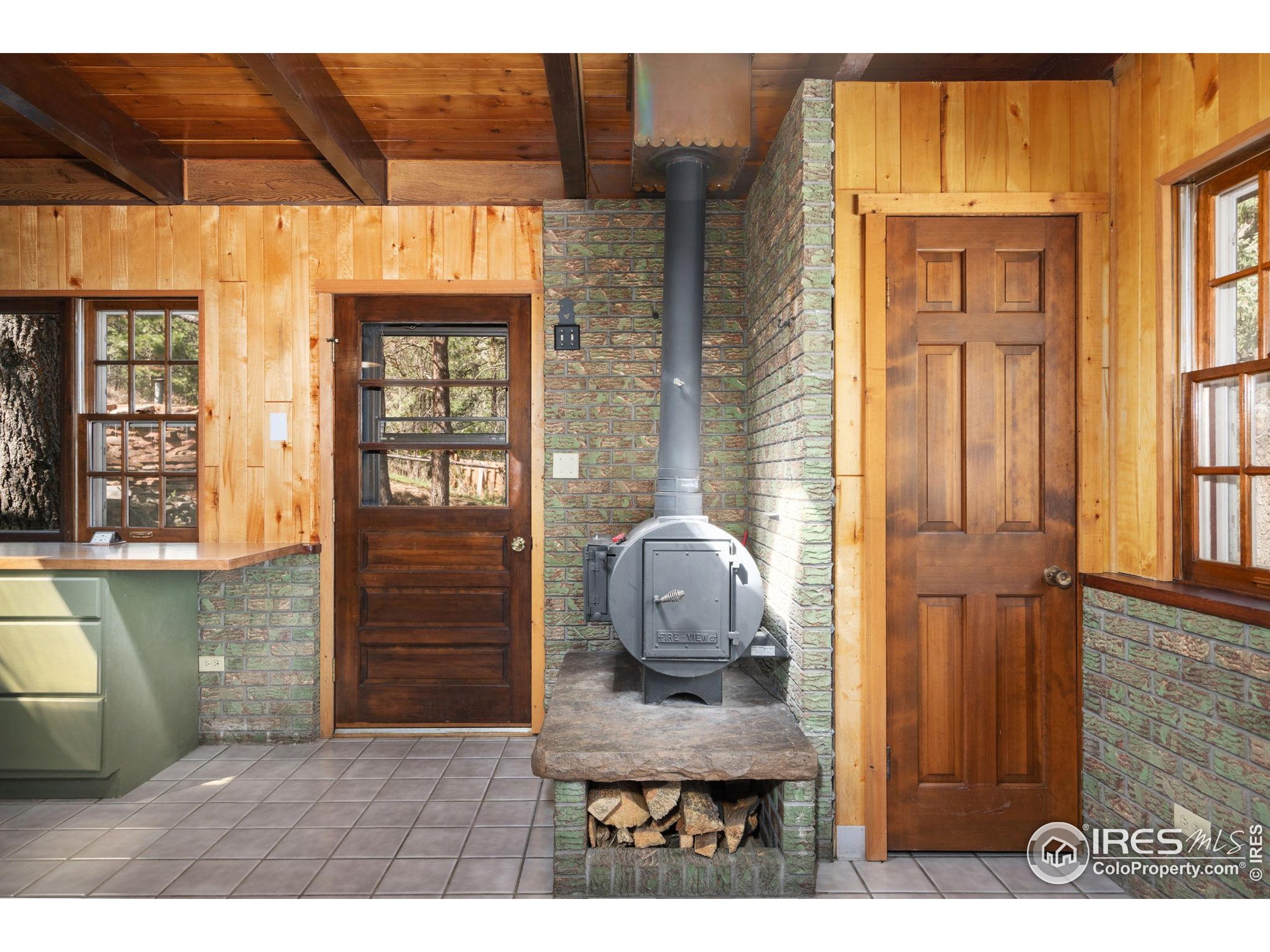7301 Poudre Canyon Road Bellvue, CO 80512 - Photo 21 of 41 a view of livingroom with furniture and windows