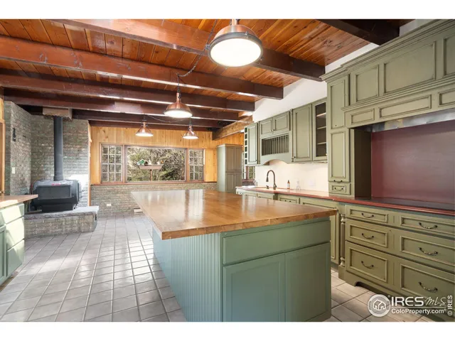 a backyard of a house with barbeque oven