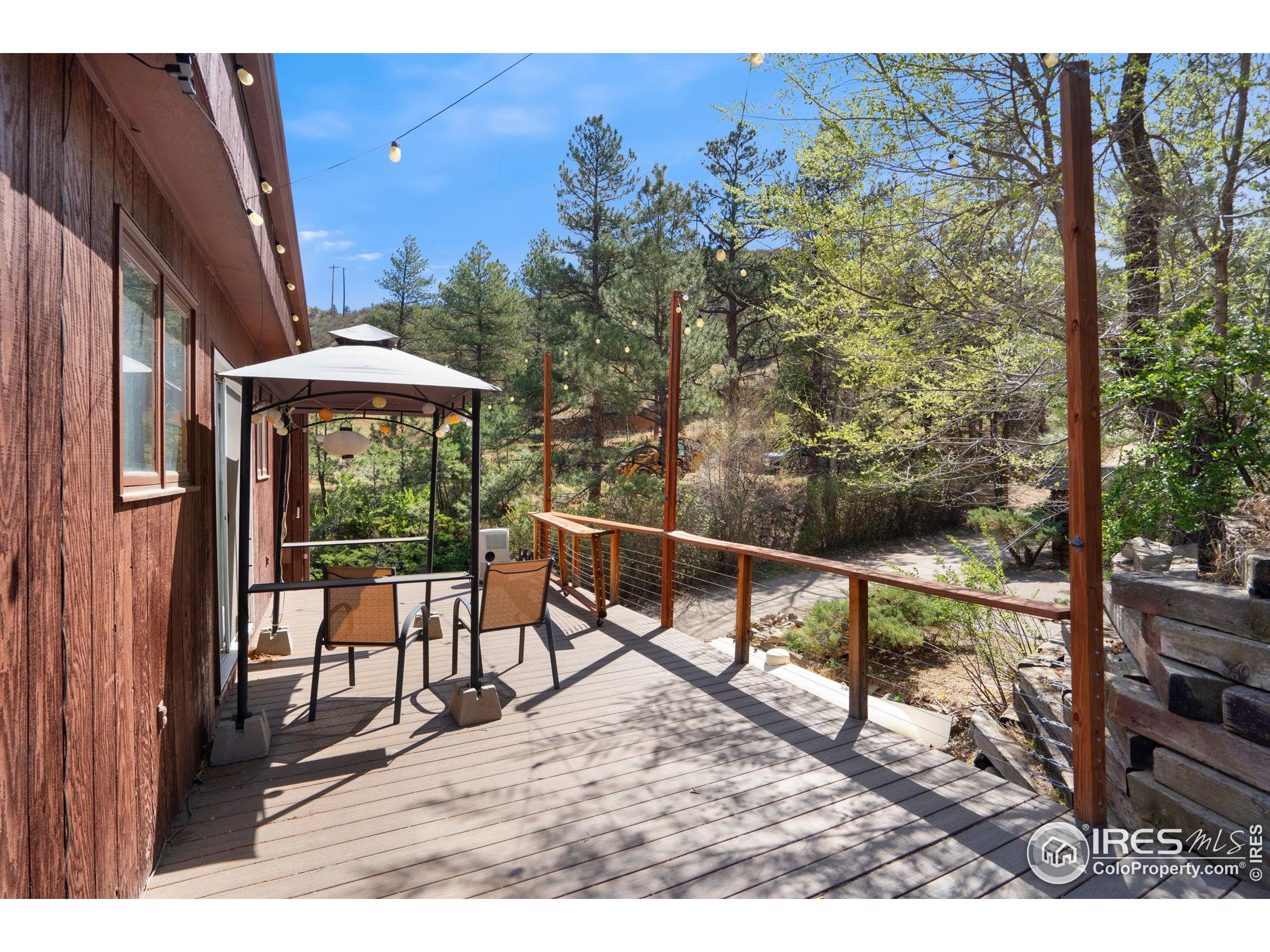 7301 Poudre Canyon Road Bellvue, CO 80512 - Photo 26 of 41 a view of a chairs and table in the balcony