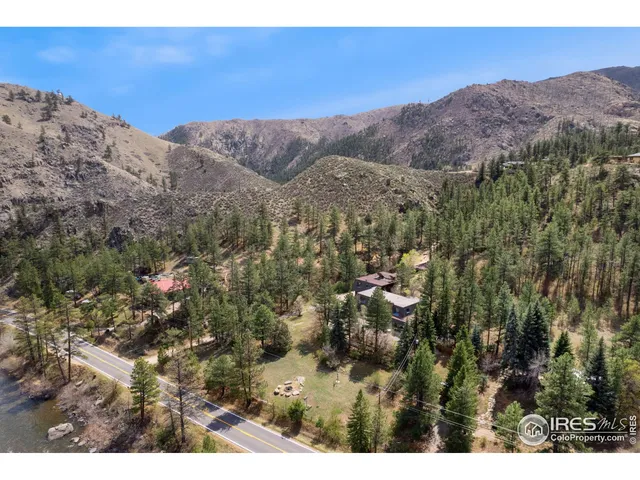 a view of outside a house and a lot of flowers